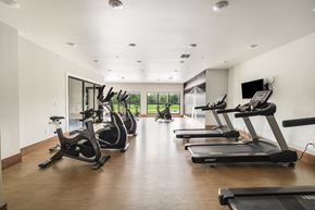 West Fargo apartment for rent - a gym with treadmills and a tv on the wallat Northern Lights a Lifestyle-Driven Community, West Fargo, North Dakota