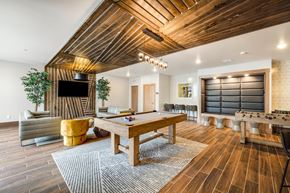West Fargo apartment for rent - a game room with a pool table and a televisionat Northern Lights a Lifestyle-Driven Community, West Fargo, ND