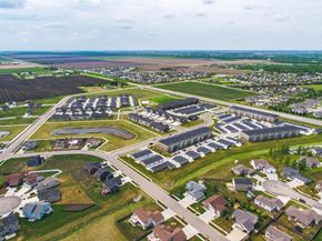 Moorhead apartment for rent - A bird's eye view of a residential area with houses and apartment buildings.