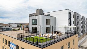 West Fargo apartment for rent - a rendering of a building with a rooftop terrace at The Standard on 32nd, West Fargo, ND