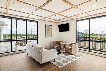 West Fargo apartment for rent - a living room with couches and chairs and large windows