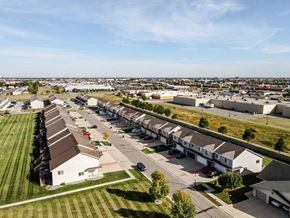 West Fargo townhouse for rent - A suburban neighborhood with houses and apartment buildings.