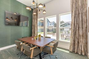 Temple apartment for rent - A conference room with a long table and chairs.