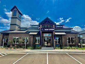 Lubbock apartment for rent - the front of the now open restaurant with a blue sky background