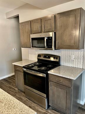 Lubbock apartment for rent - a kitchen with stainless steel appliances and a counter top