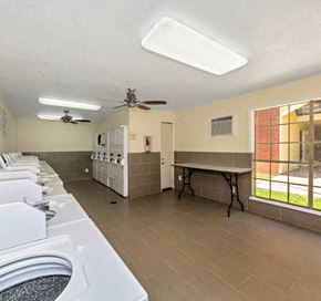 Dallas apartment for rent - a kitchen with a stove and a table