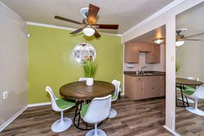 Irving apartment for rent - a dining room with a table and chairs and a kitchen