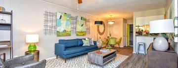 Midland apartment for rent - A living room with a blue couch and a coffee table.