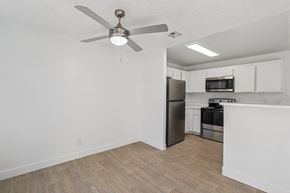 Las Vegas apartment for rent - A kitchen with a refrigerator, microwave, and oven.