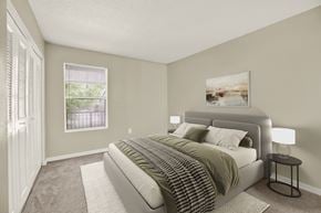 Orlando apartment for rent - A bedroom with a large bed and a painting on the wall.