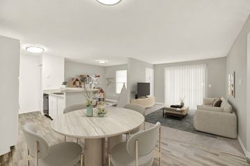 Orlando apartment for rent - A modern living room with a dining table and chairs.