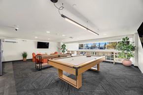 Kent apartment for rent - A room with a pool table and a television.