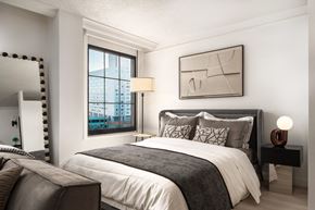 Baltimore apartment for rent - a bedroom with a bed and a window at Vision on Lombard, Baltimore, MD 21201