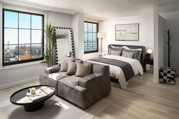Baltimore apartment for rent - a living room with a couch and a bed in a bedroom
