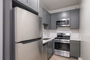 Los Angeles apartment for rent - A modern kitchen with a stainless steel refrigerator and oven at Westmore Manor Apartments, Los Angeles, 90020
