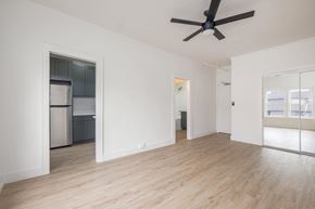 Los Angeles apartment for rent - A spacious room with a ceiling fan and wooden flooring at Westmore Manor Apartments, Los Angeles