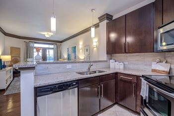 Granite countertops with tiled backsplashes