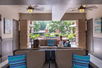 Two courtyard seating areas with televisions
