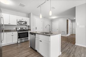 Nashua apartment for rent - a new modern kitchen with white cabinets ands stainless appliances