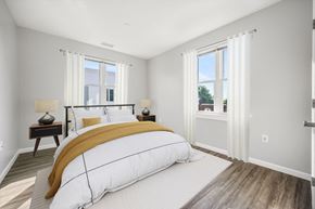 Nashua apartment for rent - a bedroom with a large bed and two windows