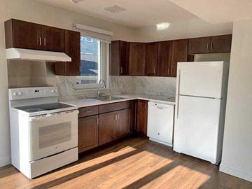 Cambridge apartment for rent - a kitchen with a stove and a refrigerator