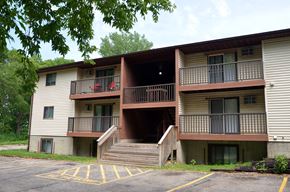 La Crosse apartment for rent - A two-story apartment building with a parking lot in front.