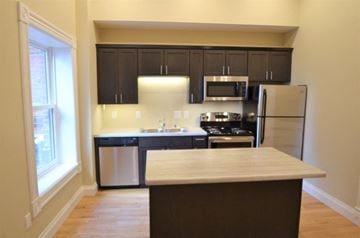 La Crosse apartment for rent - a kitchen with a counter top and a refrigerator