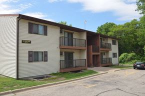 La Crosse apartment for rent - A small apartment complex with a car parked in front.