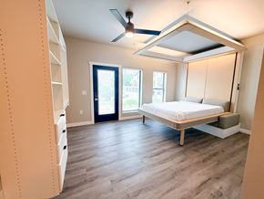 La Crosse apartment for rent - A bedroom with a bed, dresser, and window.