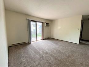 La Crosse apartment for rent - 2 BR | Living Area | Carpet | Balcony | Three Sixty Real Estate