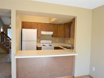 Onalaska townhouse for rent - a kitchen with a stove and a refrigerator