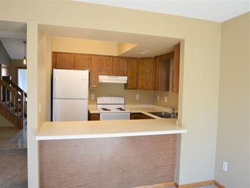 Onalaska townhouse for rent - a kitchen with a stove and a refrigerator