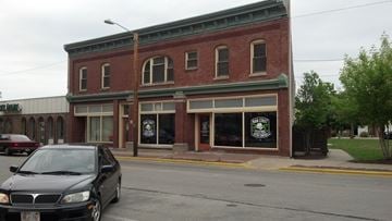 Marinette apartment for rent - an old brick building with a car parked on the street