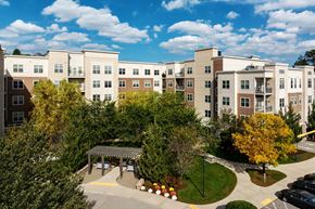 Arlington apartment for rent - A large apartment complex with a courtyard and trees.