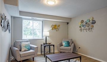 Brunswick apartment for rent - a living room with two chairs and a table