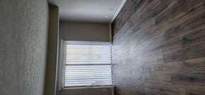 Cincinnati apartment for rent - a hallway with a window and a wooden wall