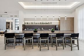 Miramar apartment for rent - A modern kitchen with a long table and chairs.