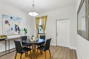 Melbourne apartment for rent - A dining room with a table set for four.