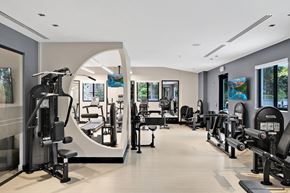 Tamarac apartment for rent - a room filled with lots of different types of exercise equipment