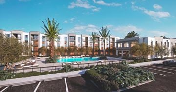 Margate apartment for rent - A modern apartment complex with a pool in the foreground.