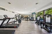 Pompano Beach apartment for rent - A gym with treadmills, weights and exercise machines.