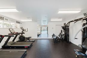 Miami apartment for rent - A gym with treadmills and weights.