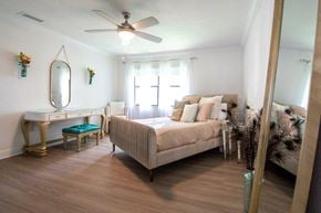 Kendall apartment for rent - a bedroom with a bed and a ceiling fan