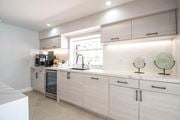 Kendall apartment for rent - a kitchen with white cabinets and a window