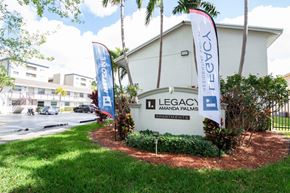 Hialeah apartment for rent - A white building with a sign that says Legacy Amanda Palms.