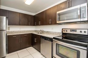 Kendall apartment for rent - a kitchen with stainless steel appliances and granite counter tops