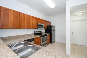 Hialeah Gardens apartment for rent - a kitchen with stainless steel appliances and granite counter tops