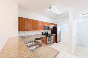 Hialeah Gardens apartment for rent - a kitchen with a granite counter top and a sink