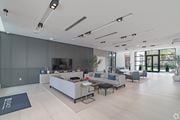 Miramar apartment for rent - A modern living room with a grey sofa set and a television.