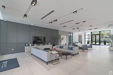 Miramar apartment for rent - A modern living room with a grey sofa set and a television.